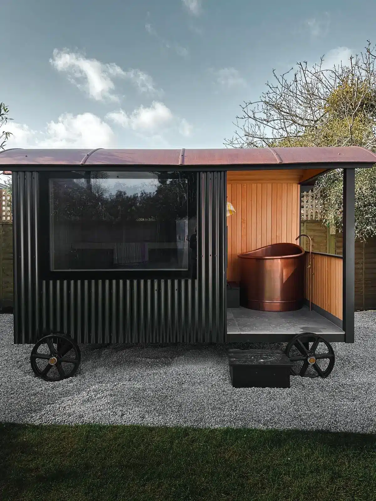 luxury-outdoor-sauna-hut-black-timber-exterior.